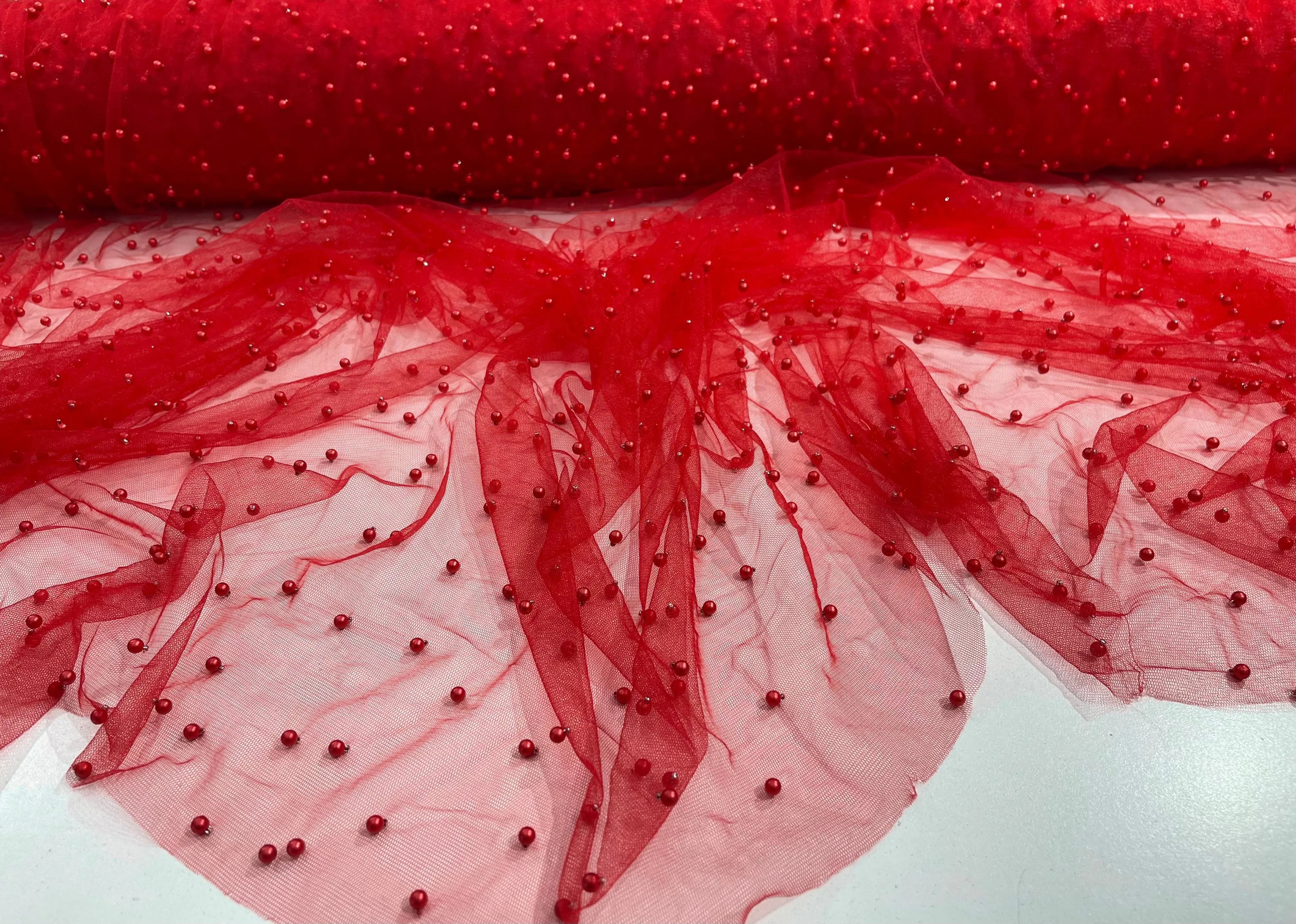 Red Scattered Pearls Studded Mesh, 2-Way Stretch, sold by the yard.