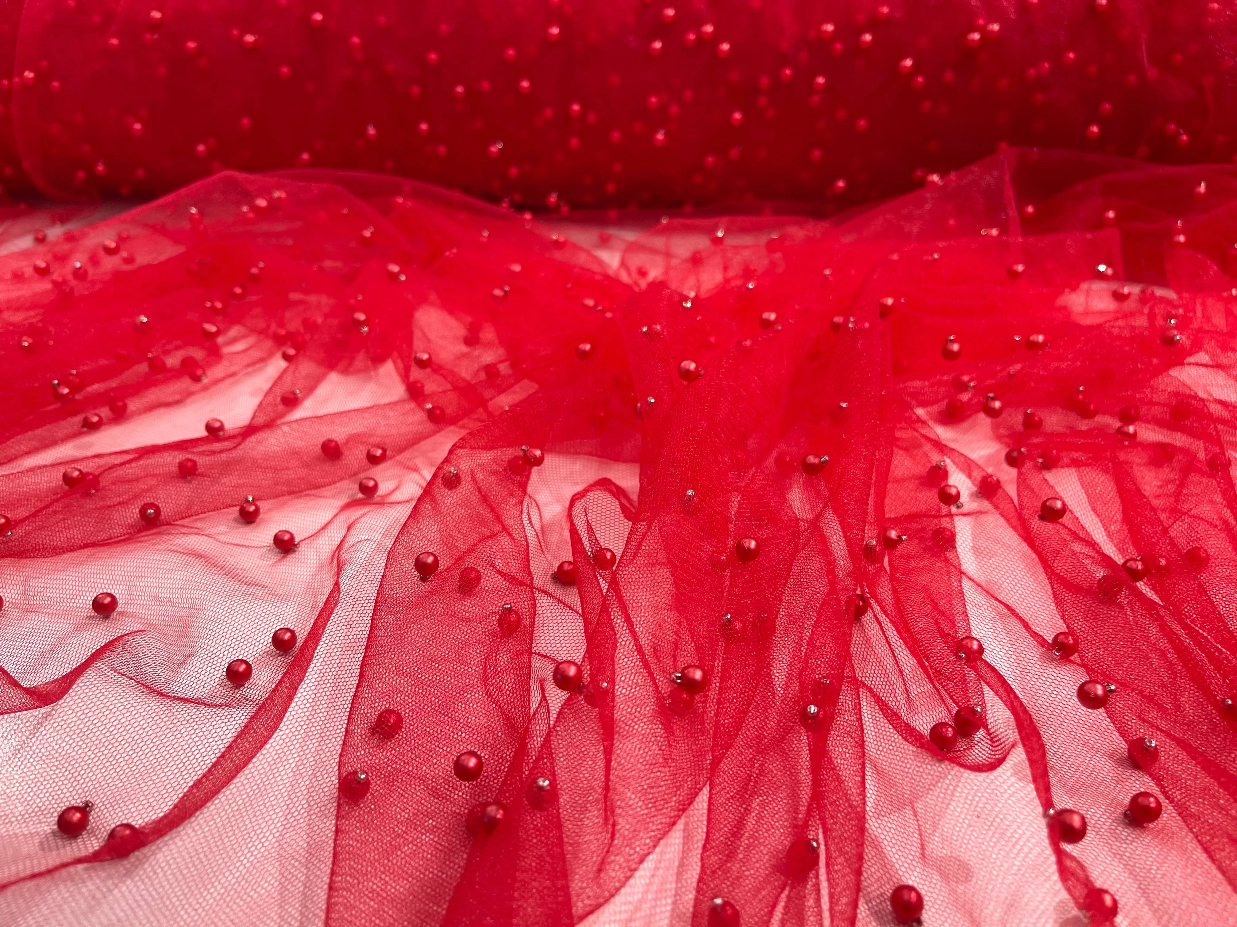 Red Scattered Pearls Studded Mesh, 2-Way Stretch, sold by the yard.
